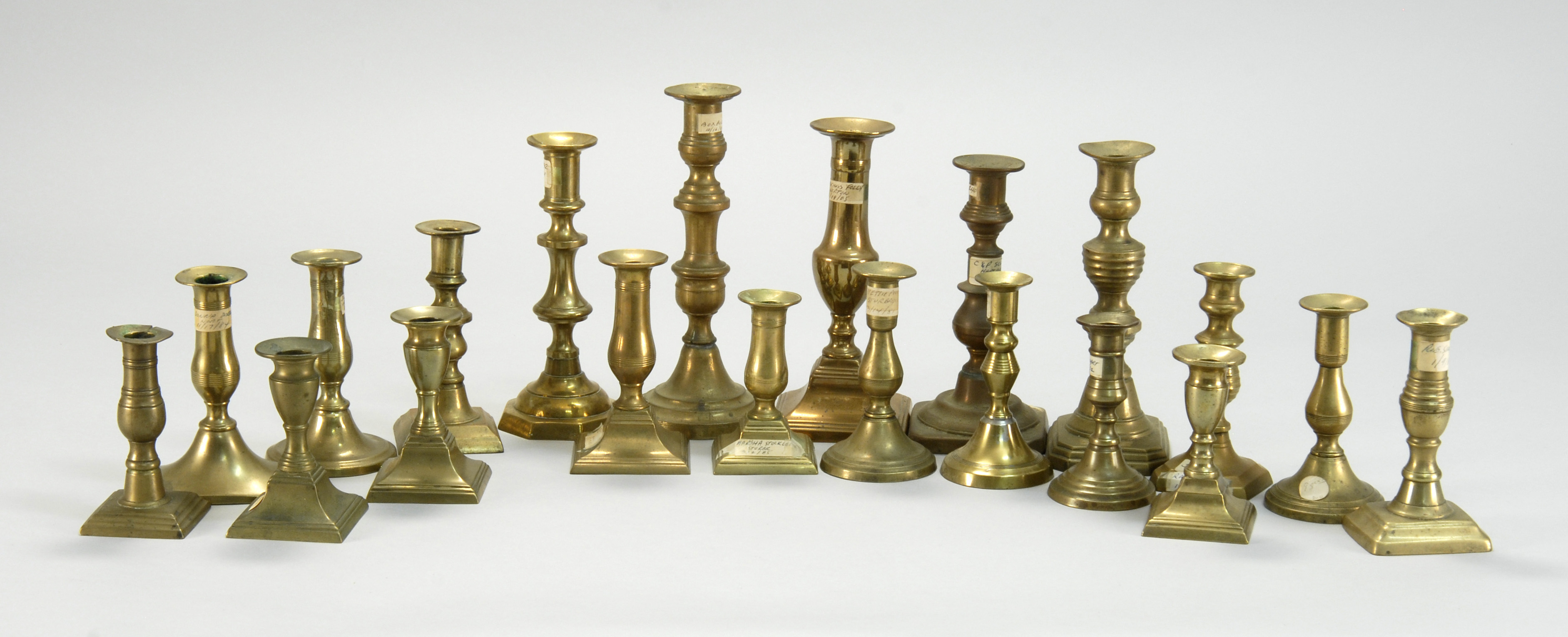 Appraisal: TWENTY ASSORTED ANTIQUE BRASS CANDLESTICKS Mostly English th CenturyHeights from