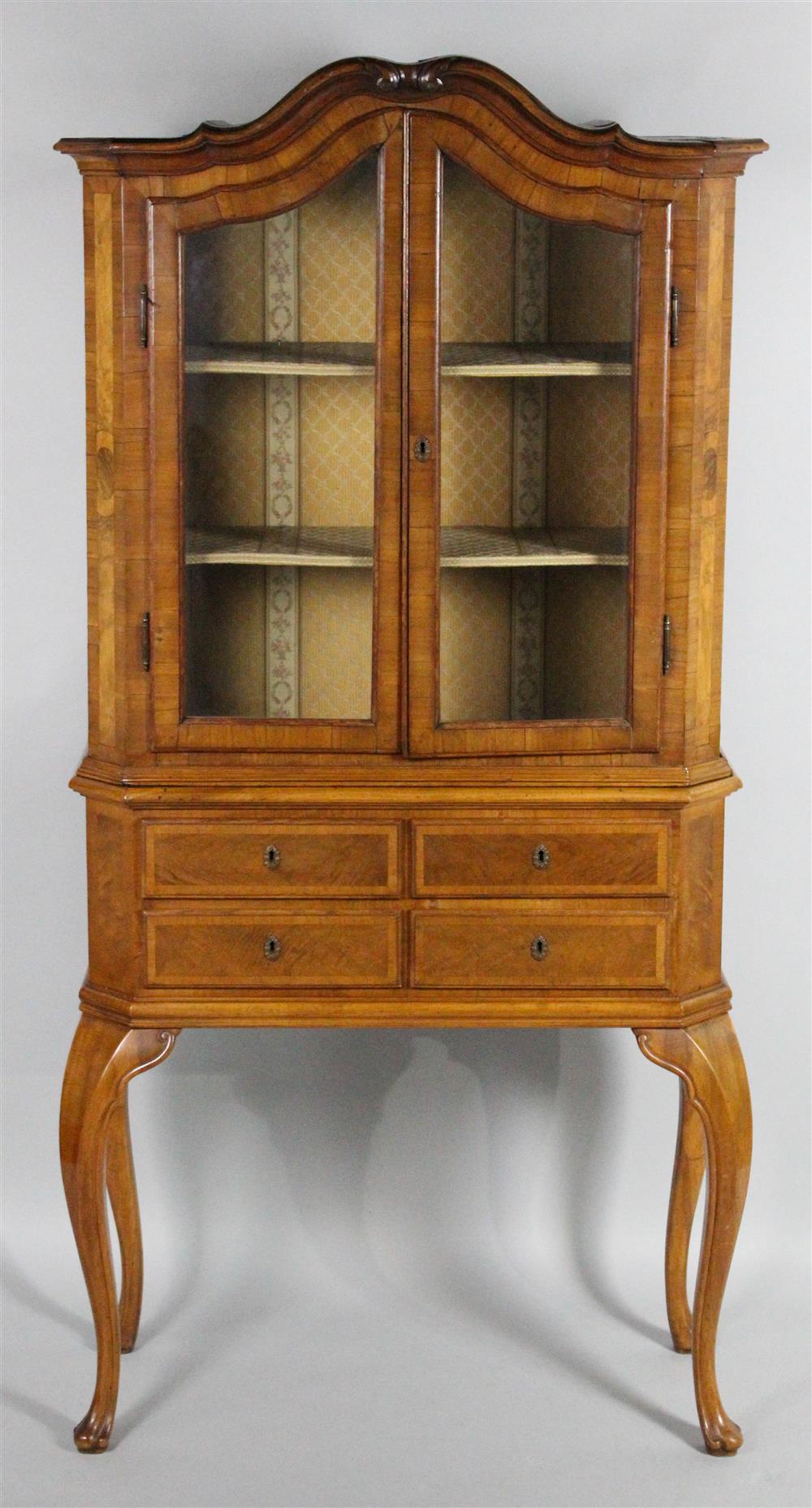 Appraisal: CONTINENTAL BAROQUE STYLE WALNUT MARQUETRY CABINET ON STAND the shaped