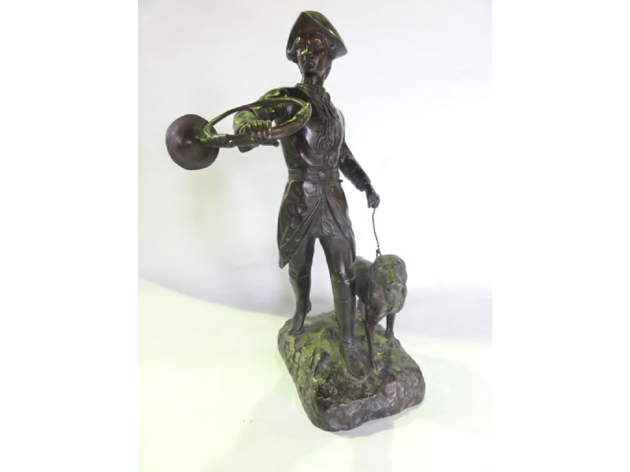 Appraisal: A French bronze study of a striding huntsman in th