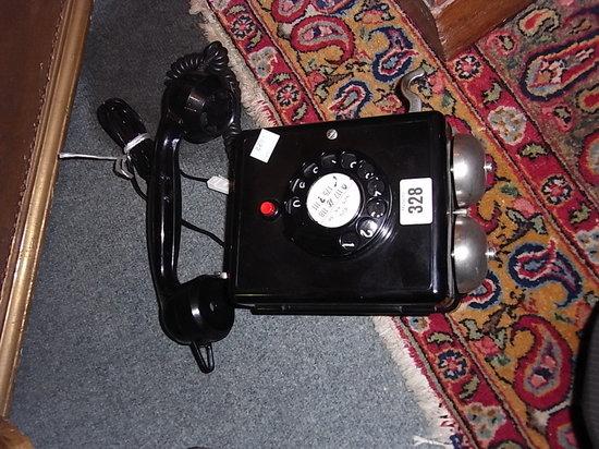 Appraisal: A SWISS WEIDMANN BLACK PLASTIC WALL MOUNTED DIAL TELEPHONE with