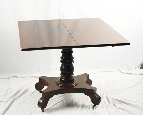 Appraisal: An Empire Mahogany Game Table having a folding top that