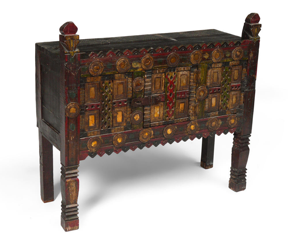 Appraisal: CARVED TIBETAN CHEST Single door cabinet raised on legs carved