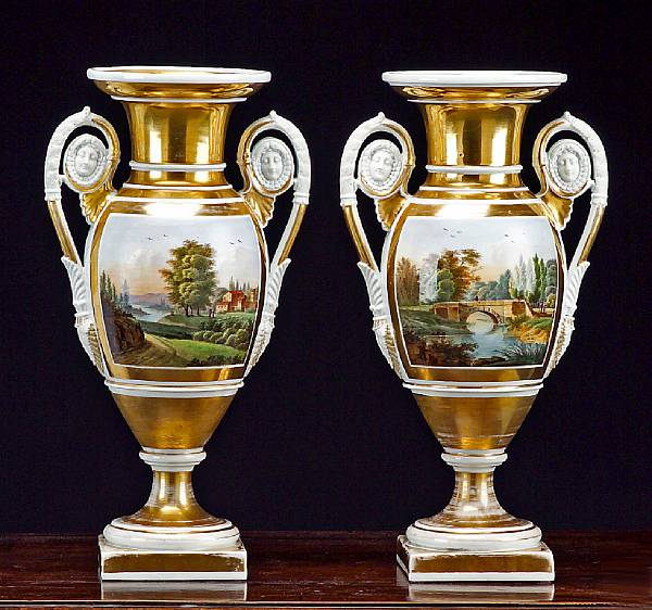 Appraisal: A pair of Paris glazed and biscuit porcelain urns th