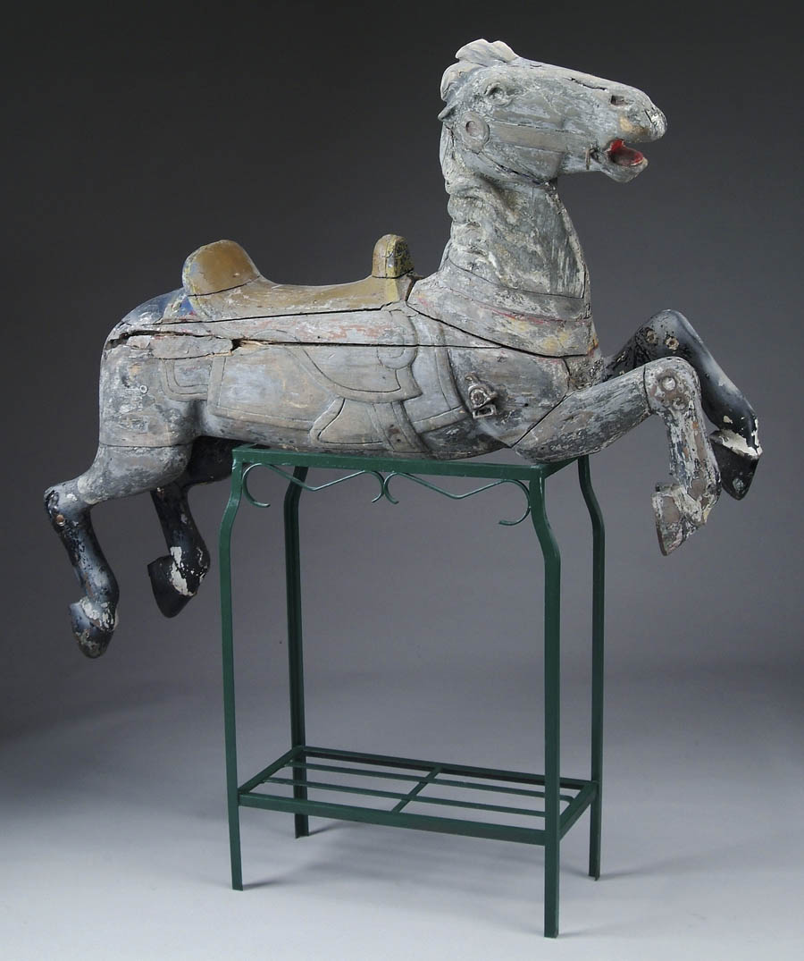 Appraisal: CARVED WOOD CAROUSEL HORSE ATTRIBUTED TO HERSCHEL Running horse has