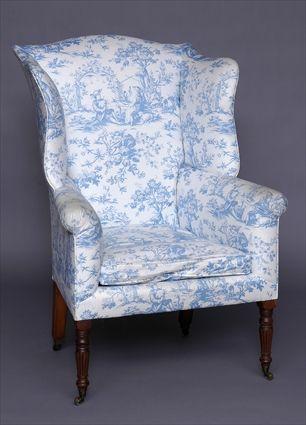 Appraisal: REGENCY CARVED AND TURNED MAHOGANY WING ARMCHAIR The upholstered seat