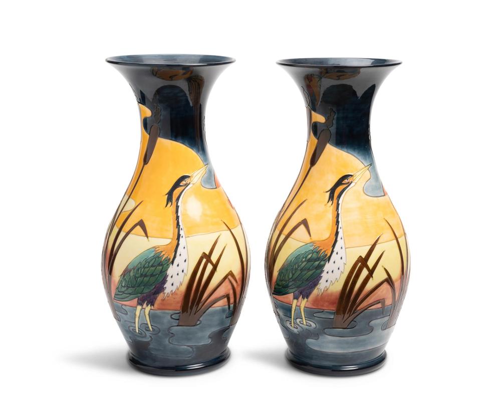 Appraisal: A pair of large Moorcroft pottery urns Each with Moorcroft