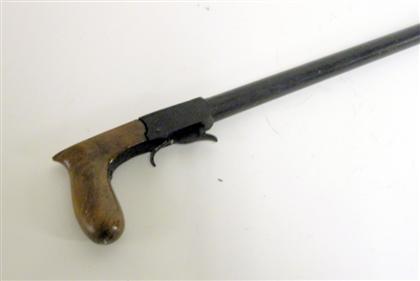 Appraisal: Victorian black walnut gameskeeper's stick gun th century