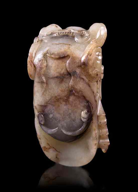 Appraisal: An Archaistic Carved Jade Cicada Qing Dynasty of near-white stone