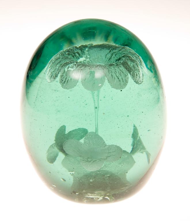 Appraisal: STOURBRIDGE GREEN GLASS DUMP PAPERWEIGHT WITH FLOWERHEAD INCLUSIONS th CENTURY