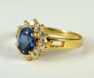 Appraisal: An ct gold sapphire and diamond cluster ring Size 'M'