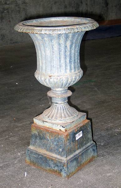 Appraisal: A pair of French Neoclassical style patinated iron urns on