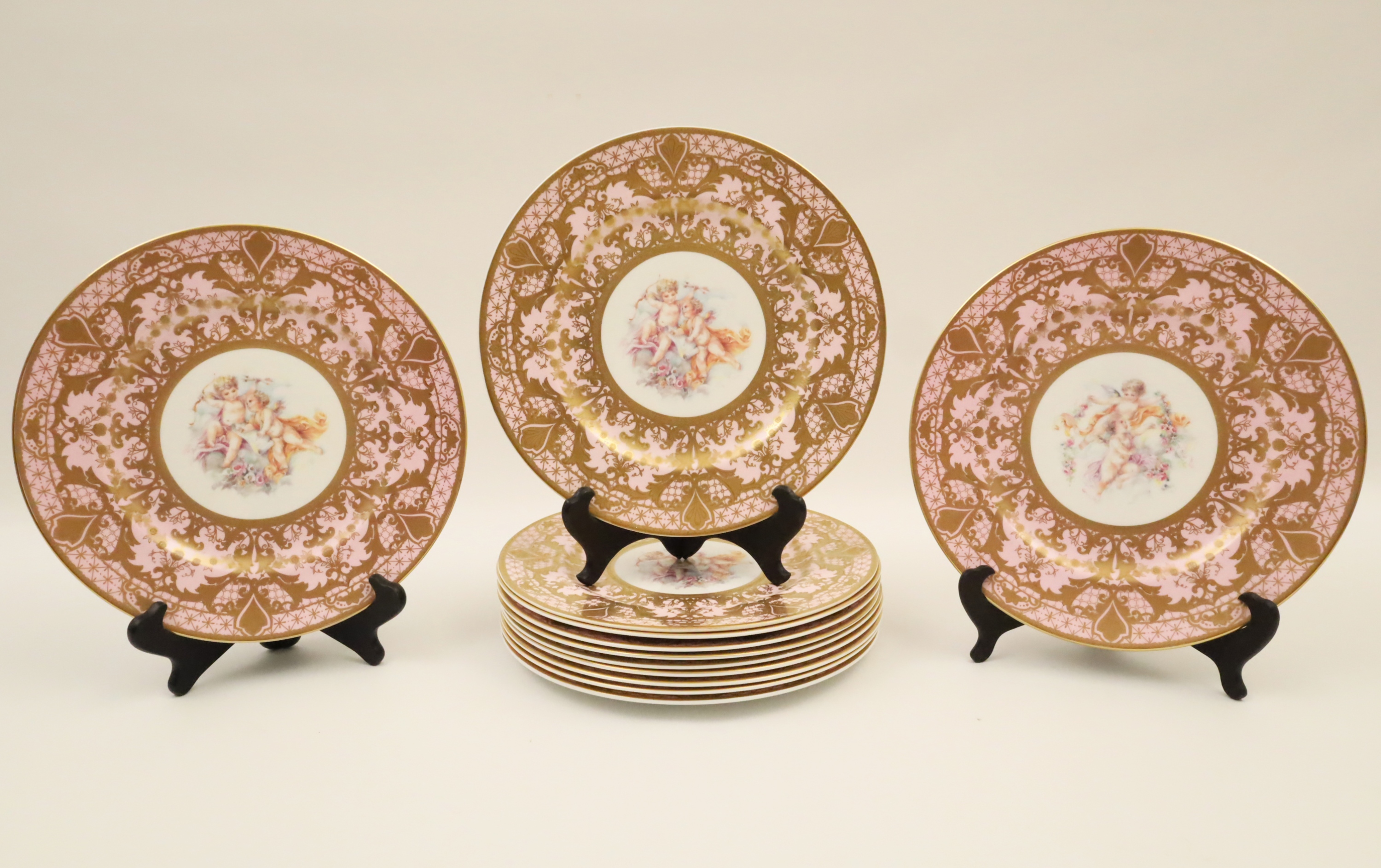 Appraisal: SET OF PINK SEVRES STYLE PORCELAIN PLATES Set of pink