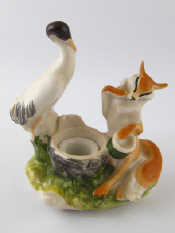 Appraisal: A Russian ceramic humorous group of a fox and a