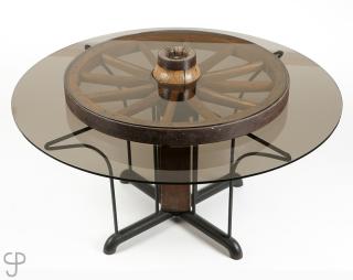 Appraisal: A smoked glass and wagon wheel kitchen table th century