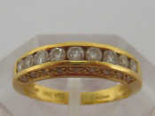 Appraisal: An carat yellow gold and diamond half hoop ring the