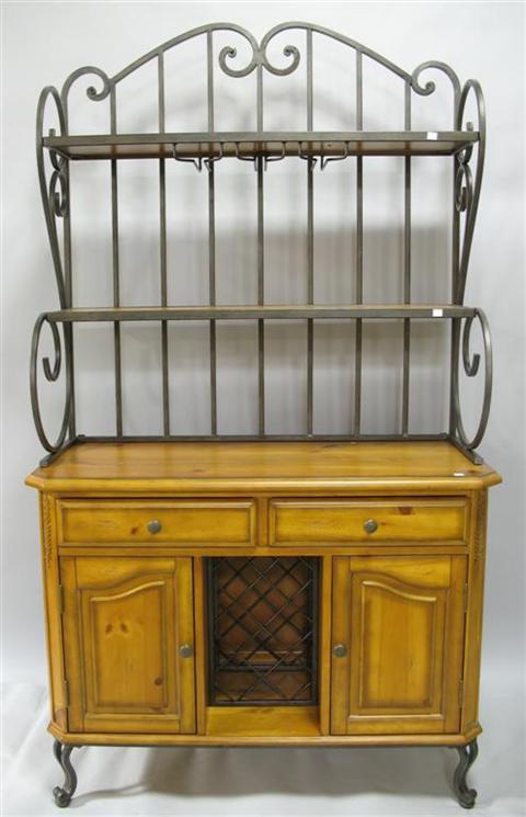 Appraisal: MODERN BAKER'S RACK th century the scrolling wrought iron back