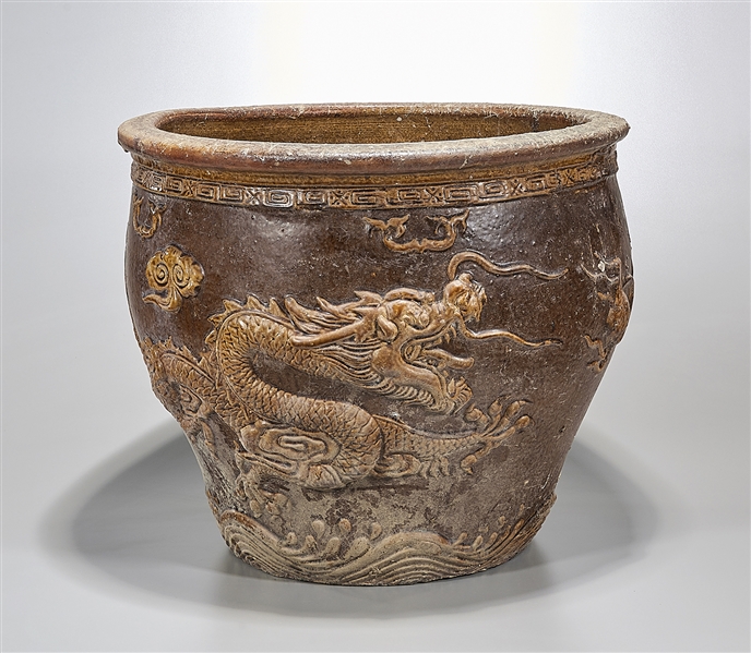 Appraisal: Chinese glazed ceramic 'dragon' jardiniere depicting molded dragons chasing pearls