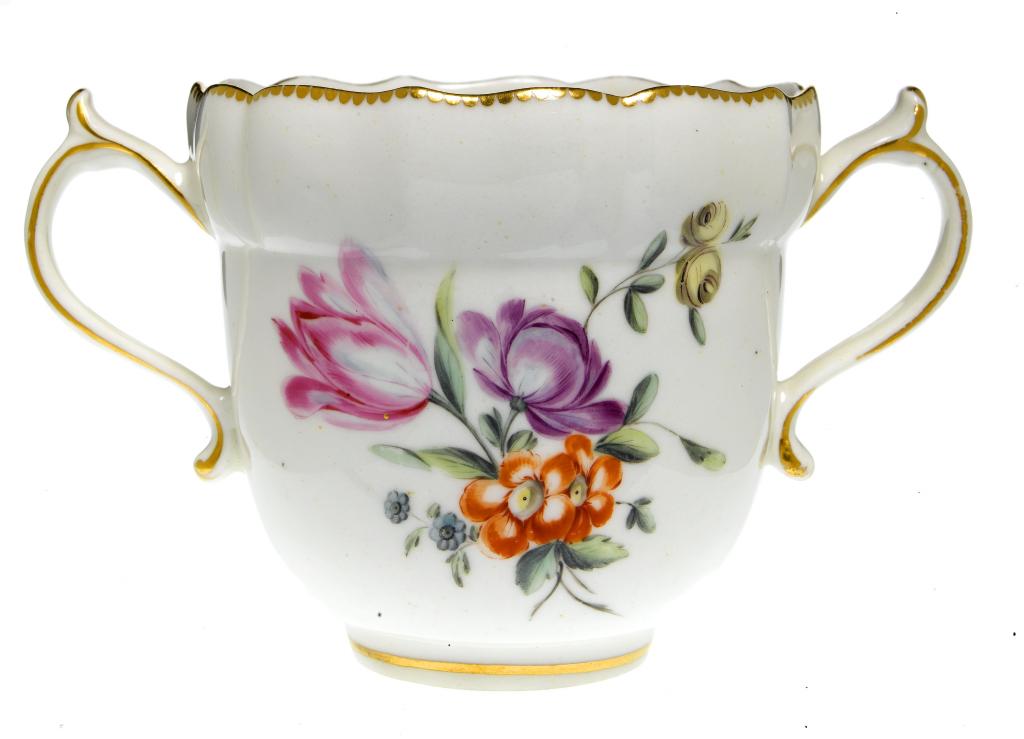 Appraisal: A CHELSEA-DERBY TWO HANDLED OGEE CUP with fluted border freely