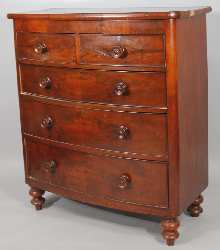 Appraisal: A Victorian mahogany bow front chest of two short and