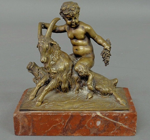 Appraisal: Bronze figural group of a young satyr riding a goat