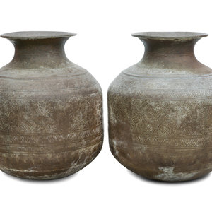 Appraisal: A Pair of Large Thai Hammered Metal Unrs TH CENTURY