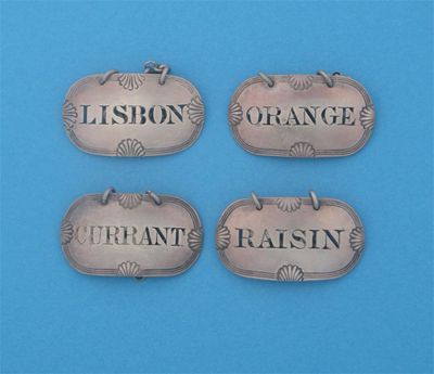 Appraisal: A set of three George III rounded oblong wine labels