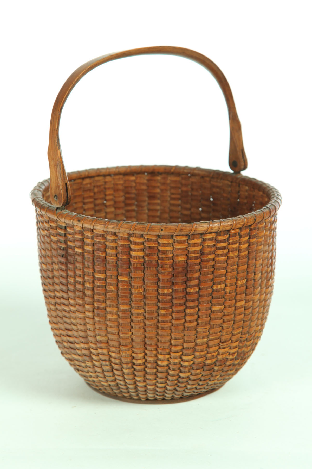 Appraisal: NANTUCKET BASKET American early th century Woven cane with bentwood