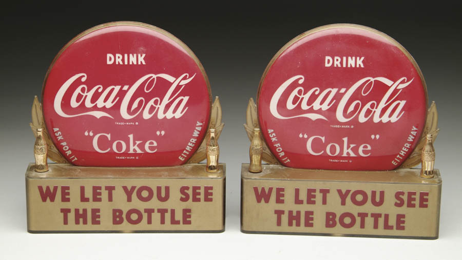 Appraisal: PAIR OF COCA-COLA BOTTLE TOPPERS Circa s plastic bottle display