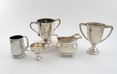 Appraisal: A modern cream jug on ball feet three small cups