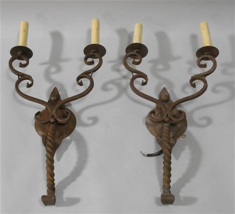 Appraisal: PAIR OF WROUGHT IRON SCONCES Fashioned in the medieval style