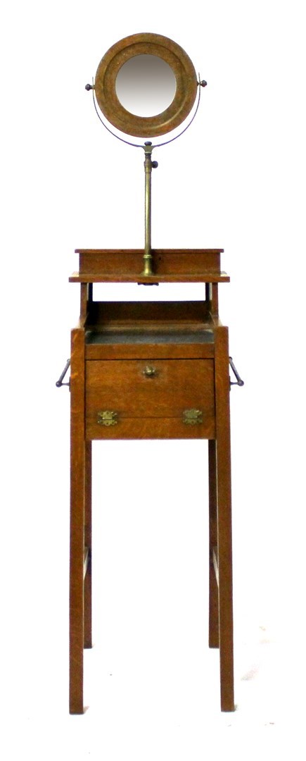 Appraisal: An early th century oak shaving stand with swing frame