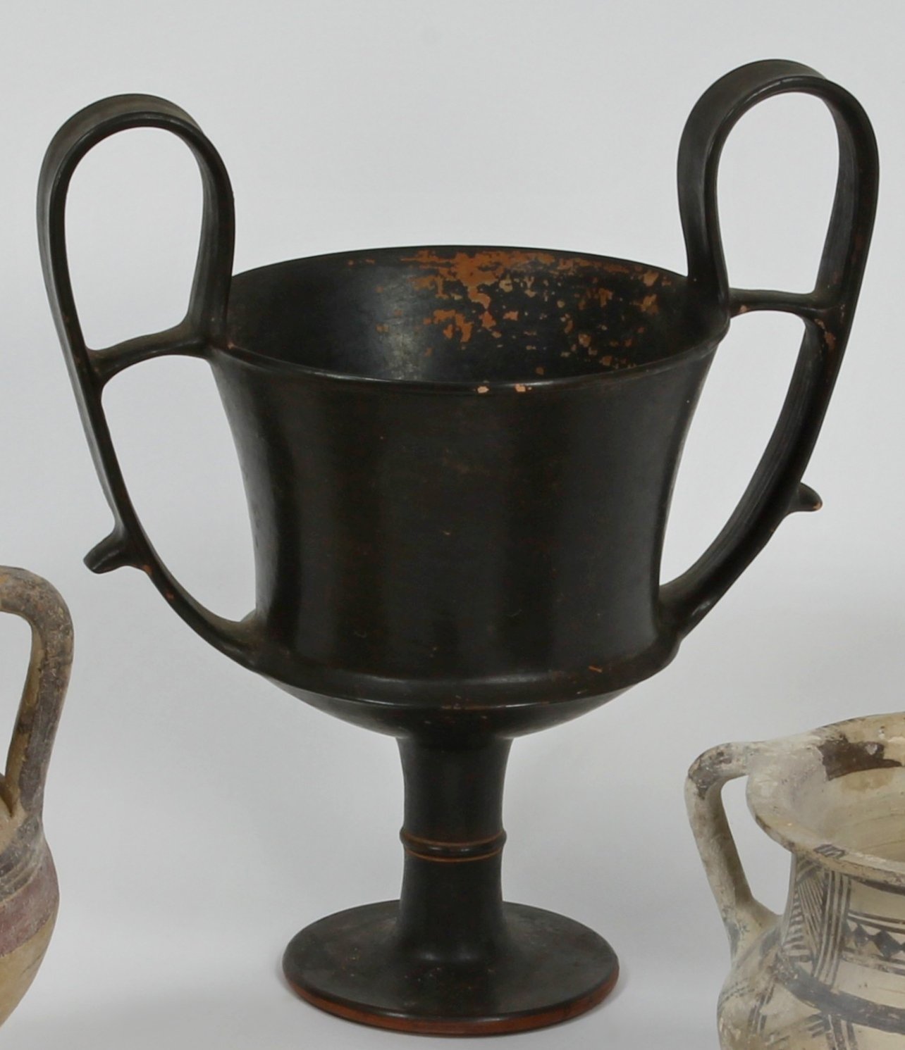 Appraisal: A south Italian black glazed pottery kantharos th Century BC