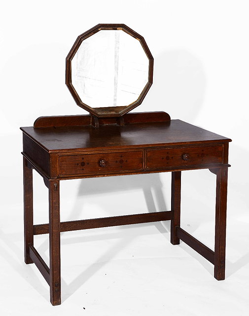 Appraisal: An early th Century Arts Crafts oak dressing tablein the