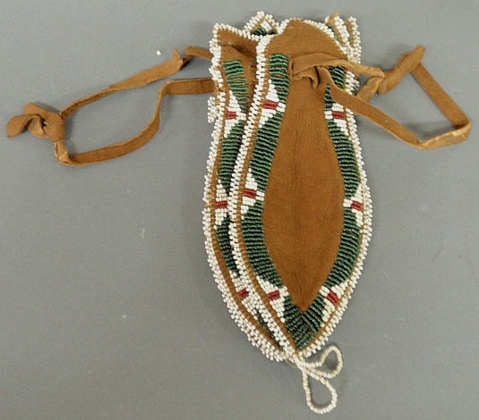 Appraisal: American Indian hide and beaded pouch th c l