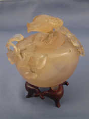 Appraisal: A Chinese carved agate bowl with carved bird finial to