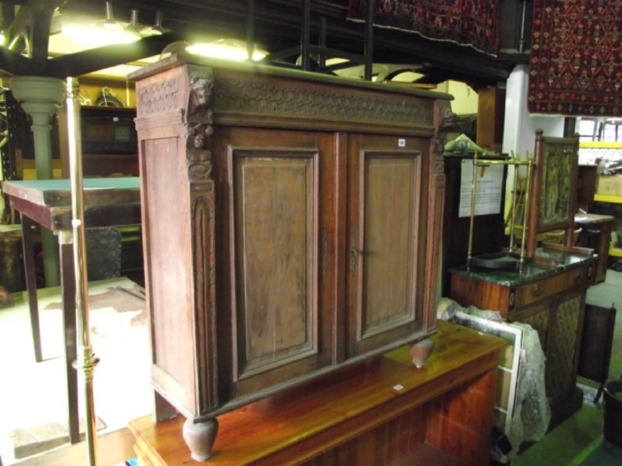 Appraisal: A th century oak side cupboard enclosed by a pair