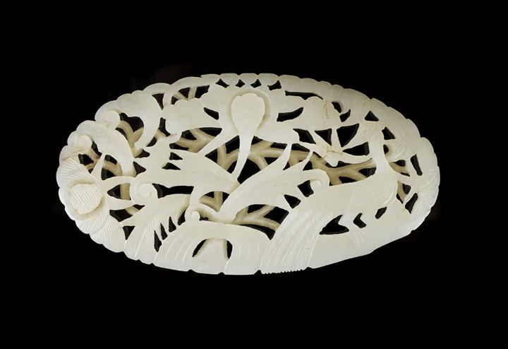 Appraisal: Chinese Carved and Reticulated Jade Belt Applique of oval outline