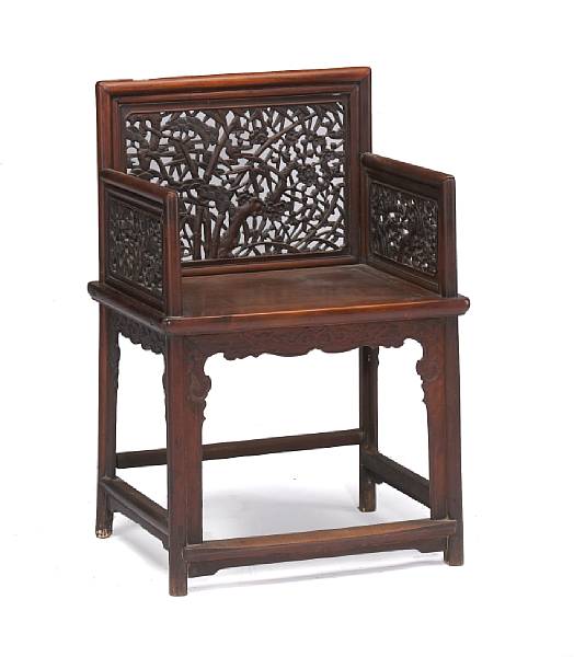 Appraisal: A carved hardwood arm chair Qing Dynasty The back and