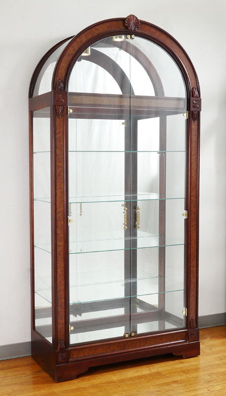 Appraisal: HOWARD MILLER CURIO DISPLAY CABINET Arched top with applied carved