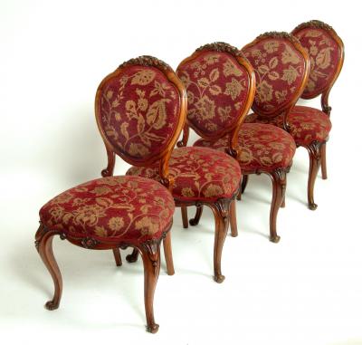 Appraisal: A SET OF FOUR VICTORIAN WALNUT SALON CHAIRS of balloon