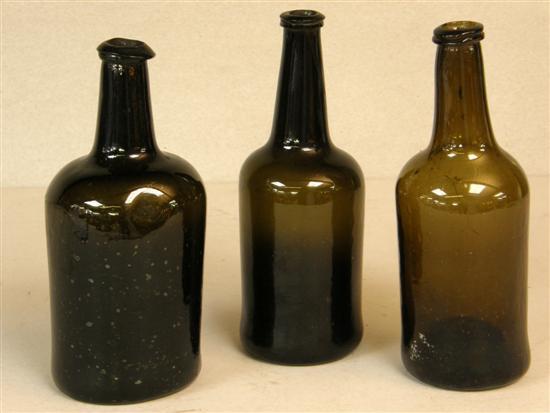 Appraisal: Three green glass straight sided bottles th century each approximately