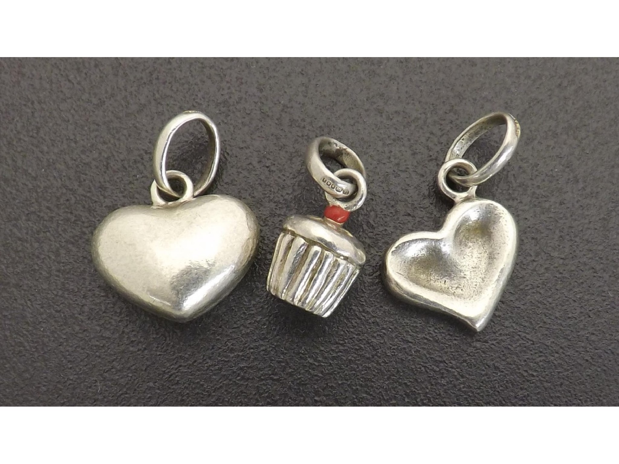 Appraisal: Three silver Links of London charms pendants