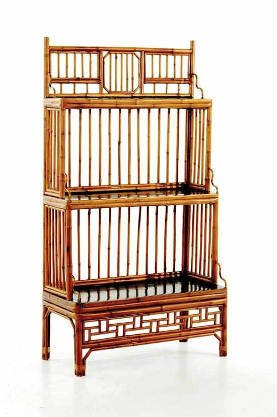 Appraisal: Oriental bamboo tiered bookshelf geometric gallery surmounting three black-painted shelves