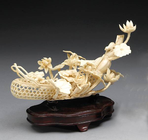 Appraisal: A carved ivory study of a crab basket and lotus