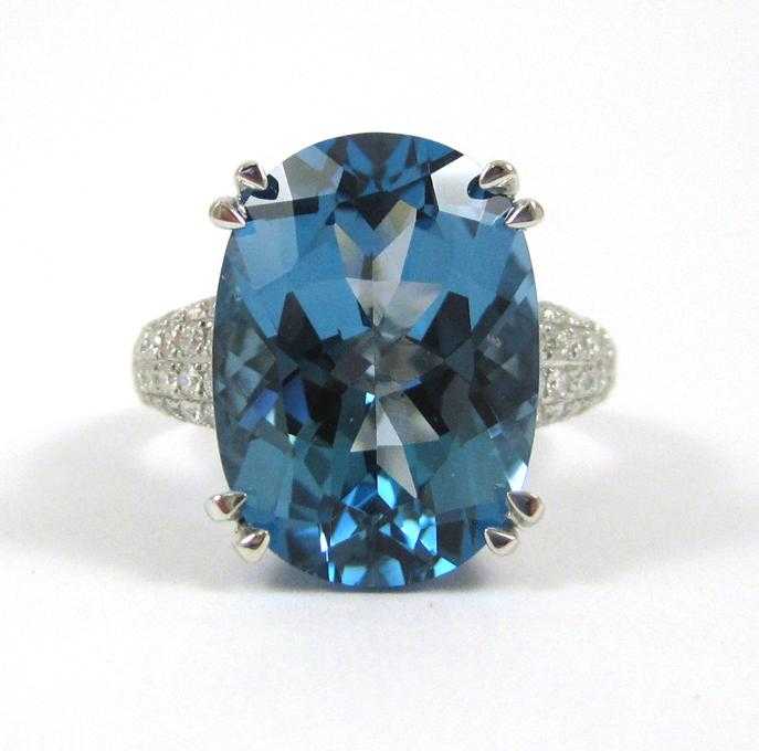 Appraisal: BLUE TOPAZ DIAMOND AND FOURTEEN KARAT GOLD RING The white