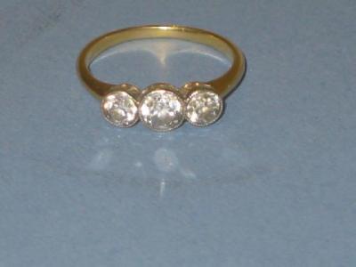 Appraisal: A VICTORIAN THREE STONE RING the old brilliant cut stones