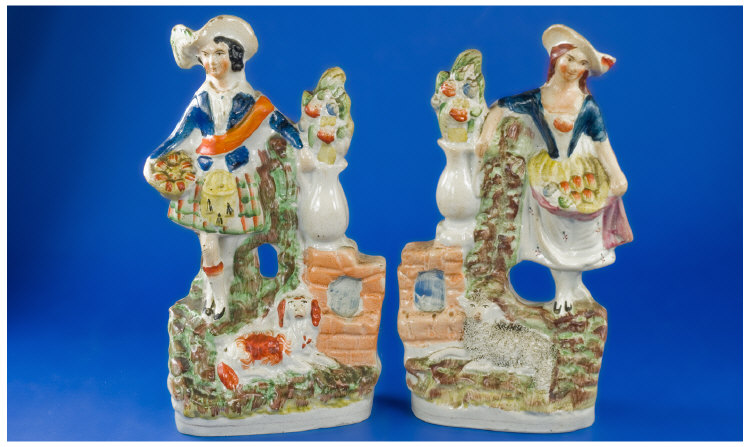 Appraisal: Pair of Staffordshire Figures A Scottish gentleman in his kilt