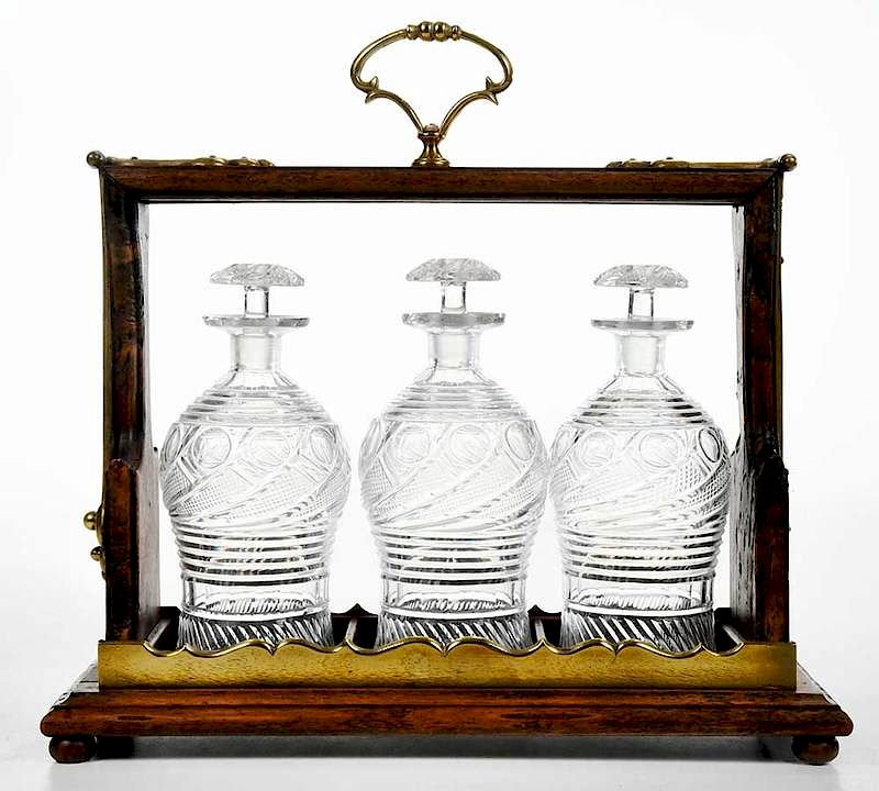 Appraisal: Bronze Mounted Tantalus with Cut Glass Decanters British Continental th