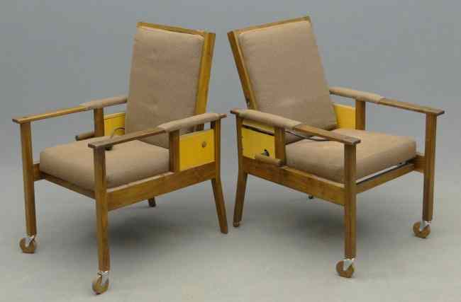 Appraisal: Pair unusual Mid Century reclining chairs on wheels Rear right