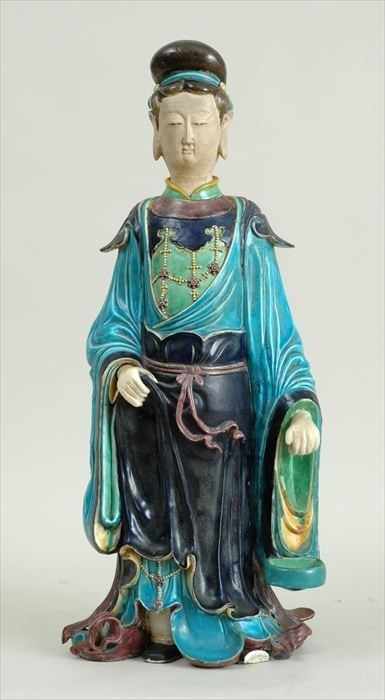 Appraisal: MING-STYLE GLAZED POTTERY FIGURE WEARING TURQUOISE COAT GREEN SHIRT AND